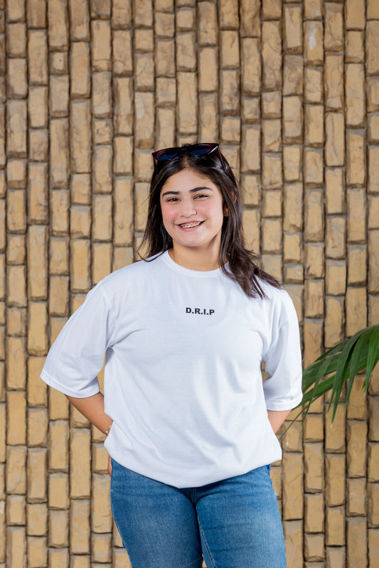 White oversized t-shirt with SLAP front and colorful “Delulu Is The Solulu” back print

