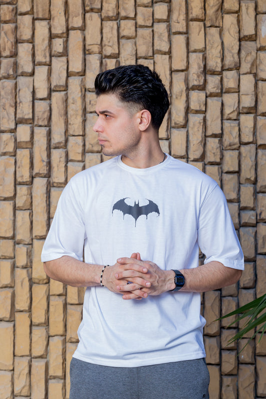 White oversized t-shirt with front Batman logo and back graphic print of Batman

